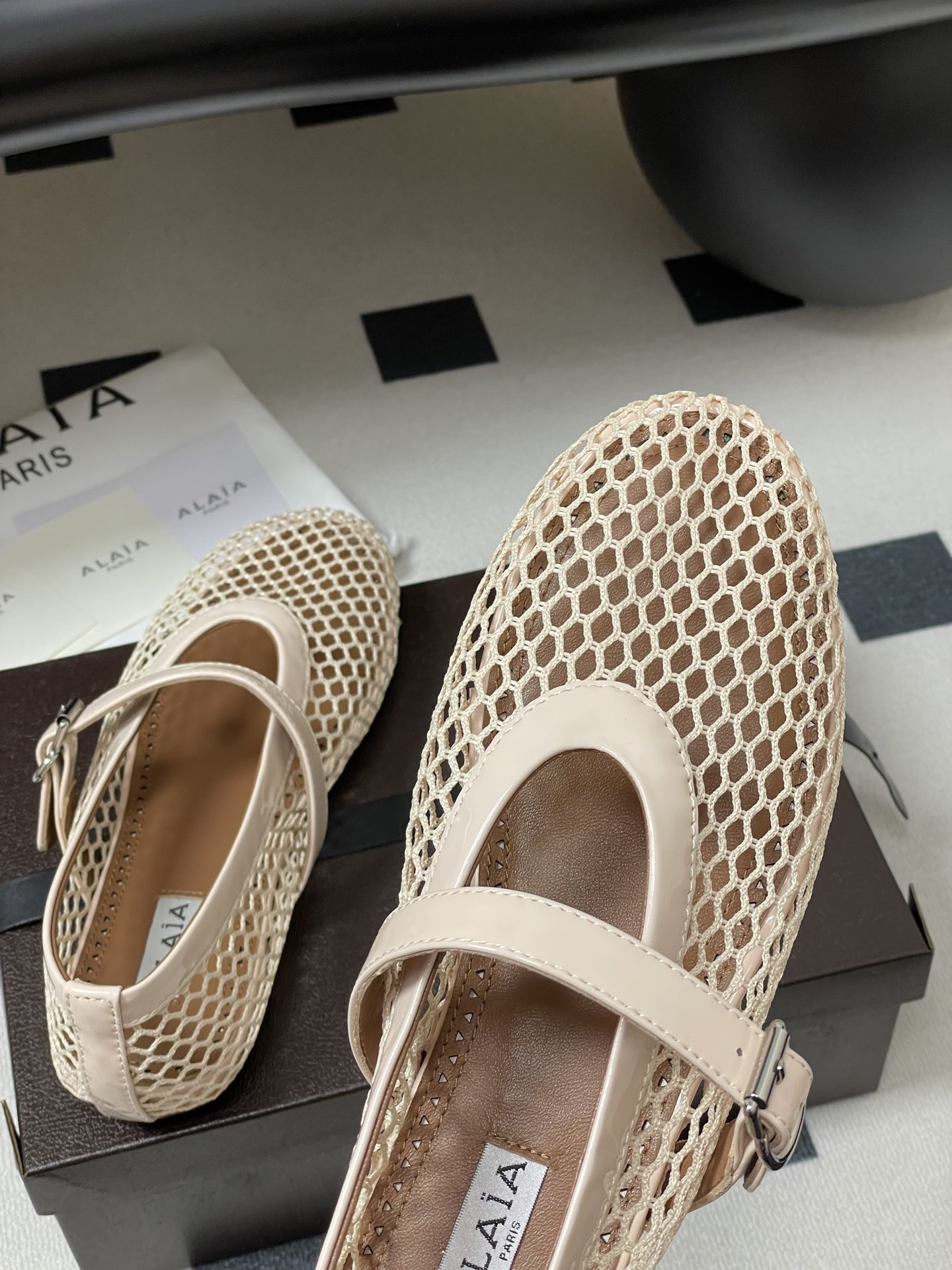 UA ALAÏA BALLET FLATS IN FISHNET