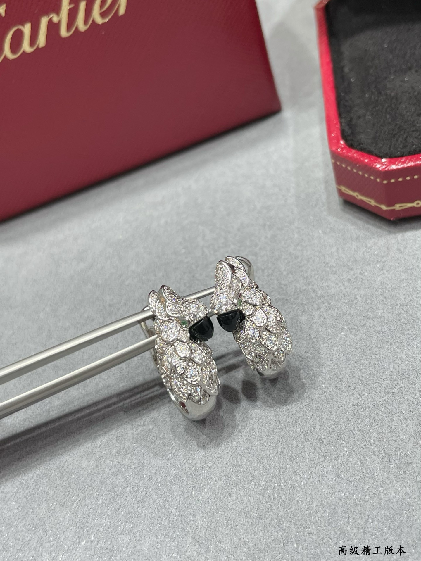 Ca*t1er Parrot Earrings