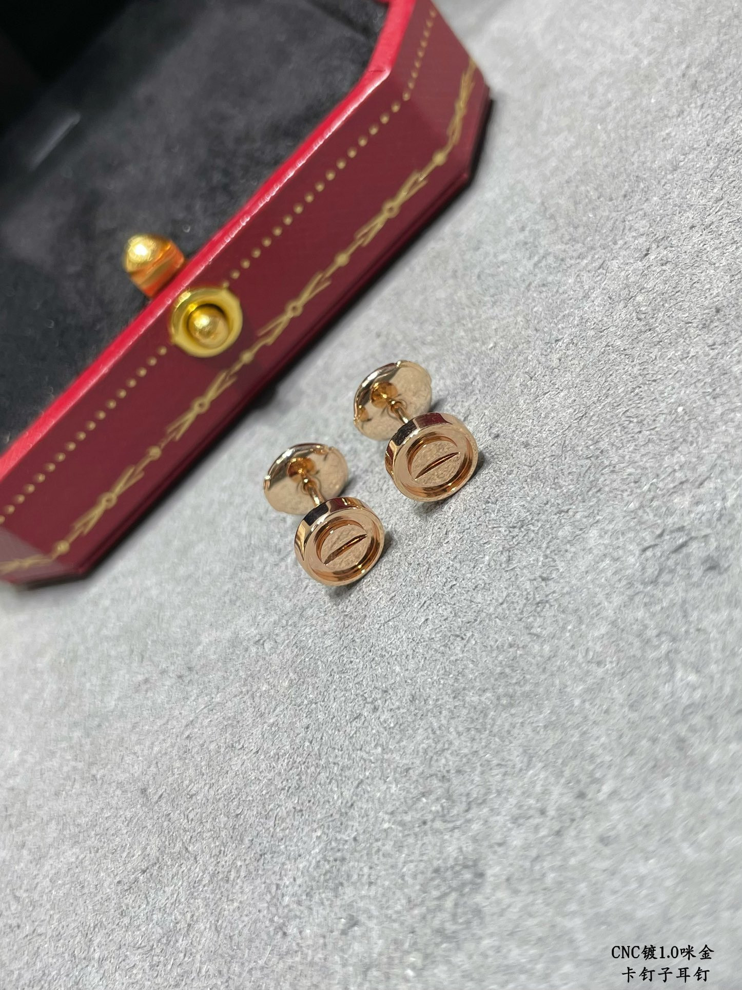 Ca*t1er nail earrings