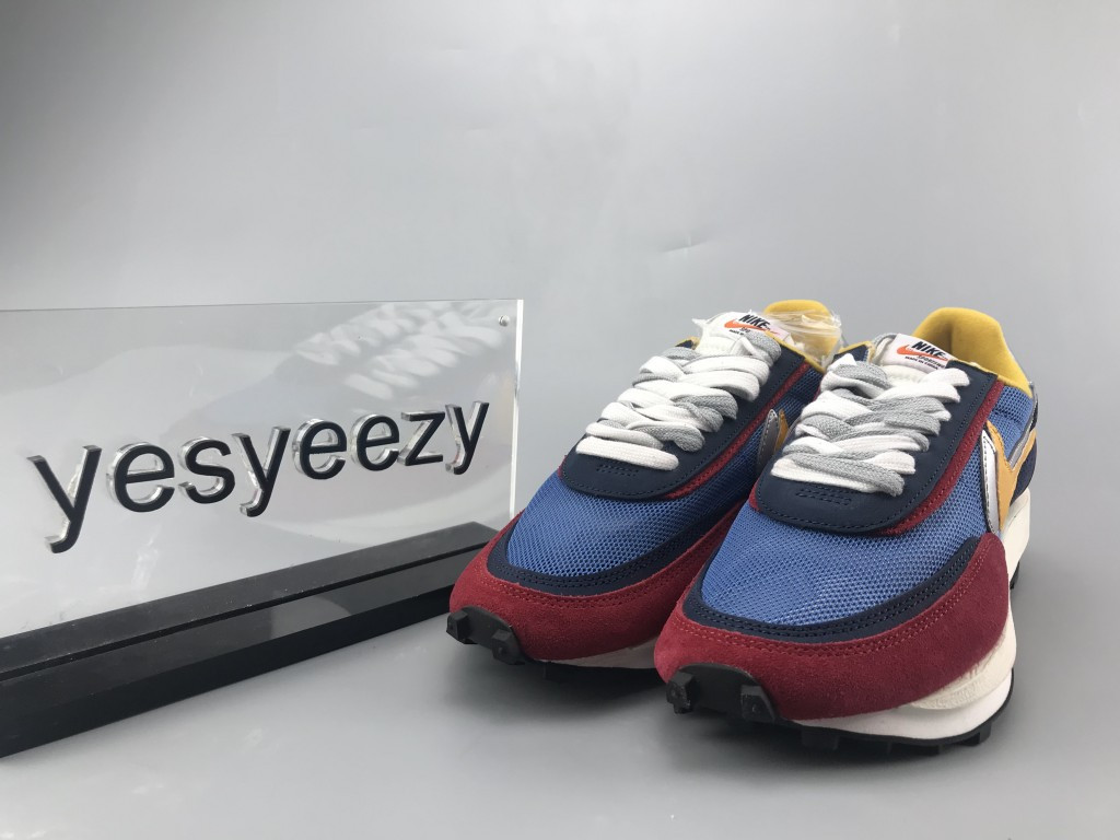 UA NIKE LDWAFFLE/SACAI "VARSITY BLUE"