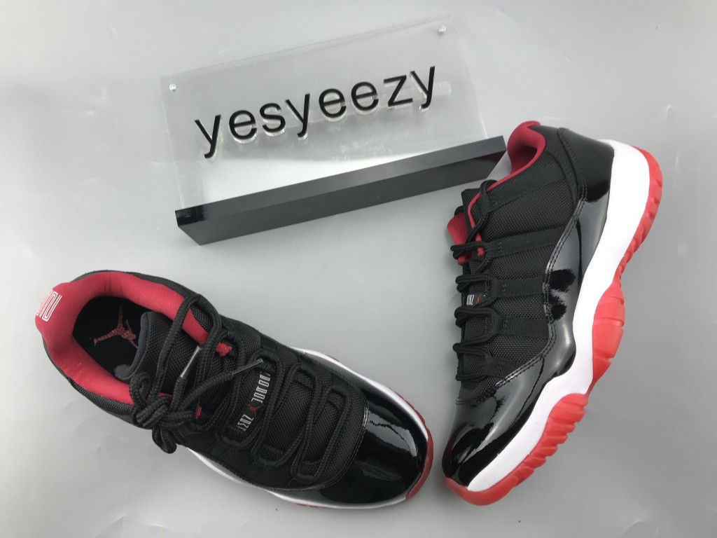 UA AIR JORDAN 11 RETRO LOW BRED