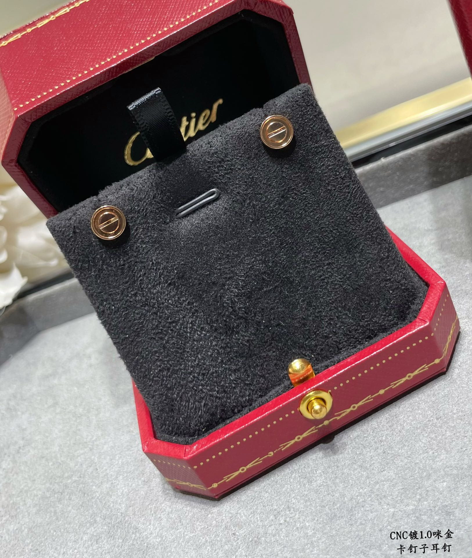 Ca*t1er nail earrings