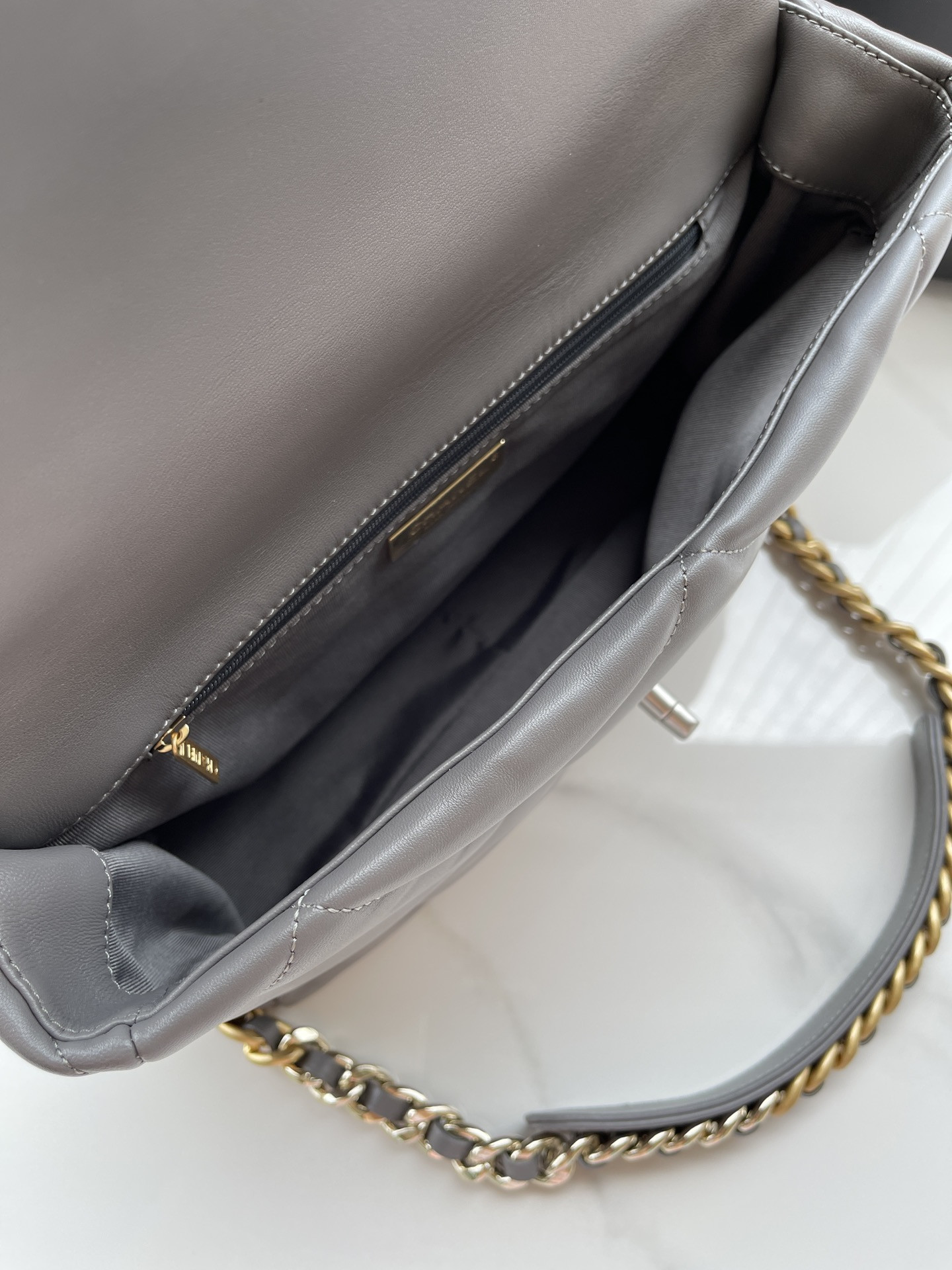 Ch**el 19 LARGE HANDBAG Shiny Leather, Gold-Tone, Silver-Tone & Ruthenium-Finish Metal Gray 7.8 × 11.7 × 3.9 in