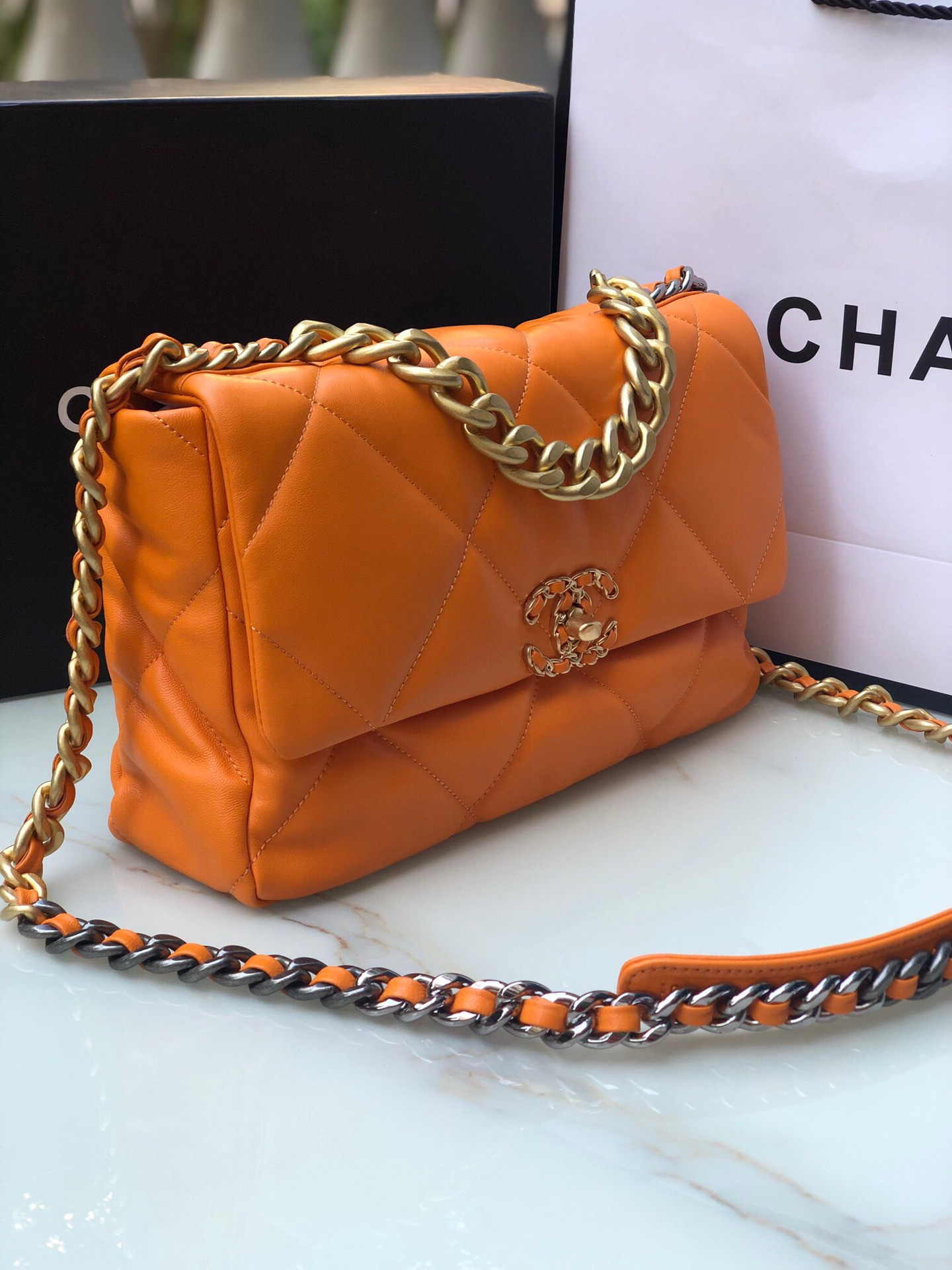 Ch**el 19 LARGE HANDBAG Shiny Leather, Gold-Tone, Silver-Tone & Ruthenium-Finish Metal Orange 7.8 × 11.7 × 3.9 in