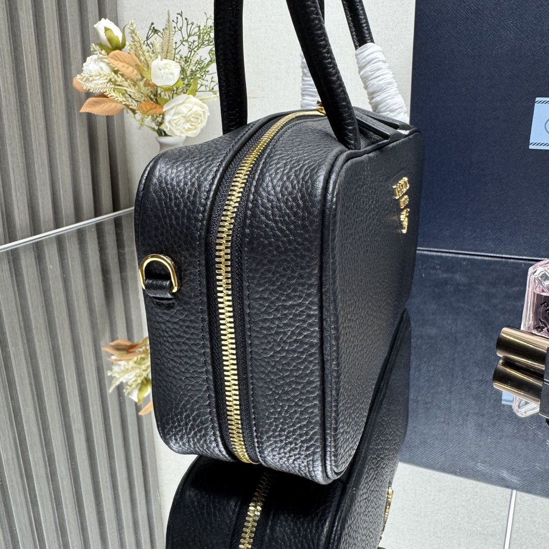 Pra*a Medium top handle bag in Vitello Dino soft leather 13x28x8cm